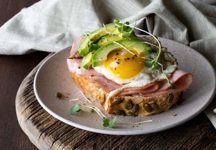 Broccoli sprouts on avocado and egg toast