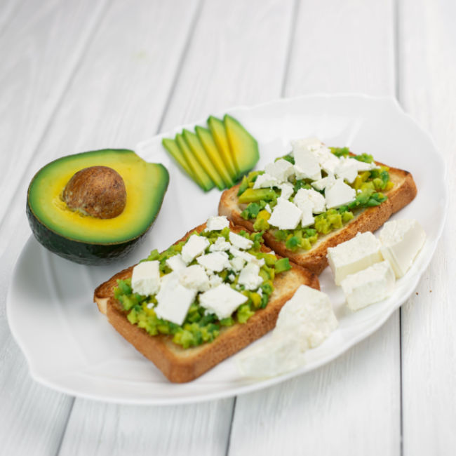 avocado toast topped with feta