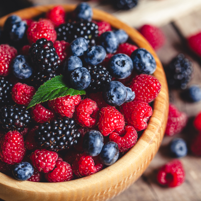 bowl of raspberries, bananas, blueberries