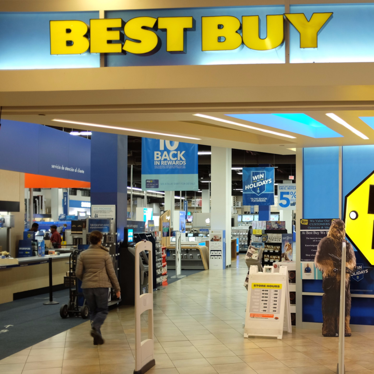 best buy inside mall opening storefront checkout yellow lettering people shopping