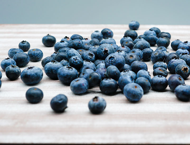 Blueberries spilled on a table