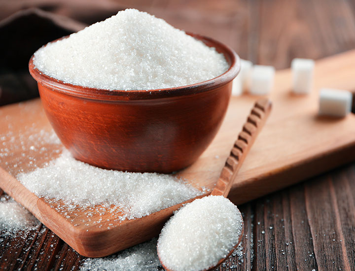 Bowl and spoon with sugar