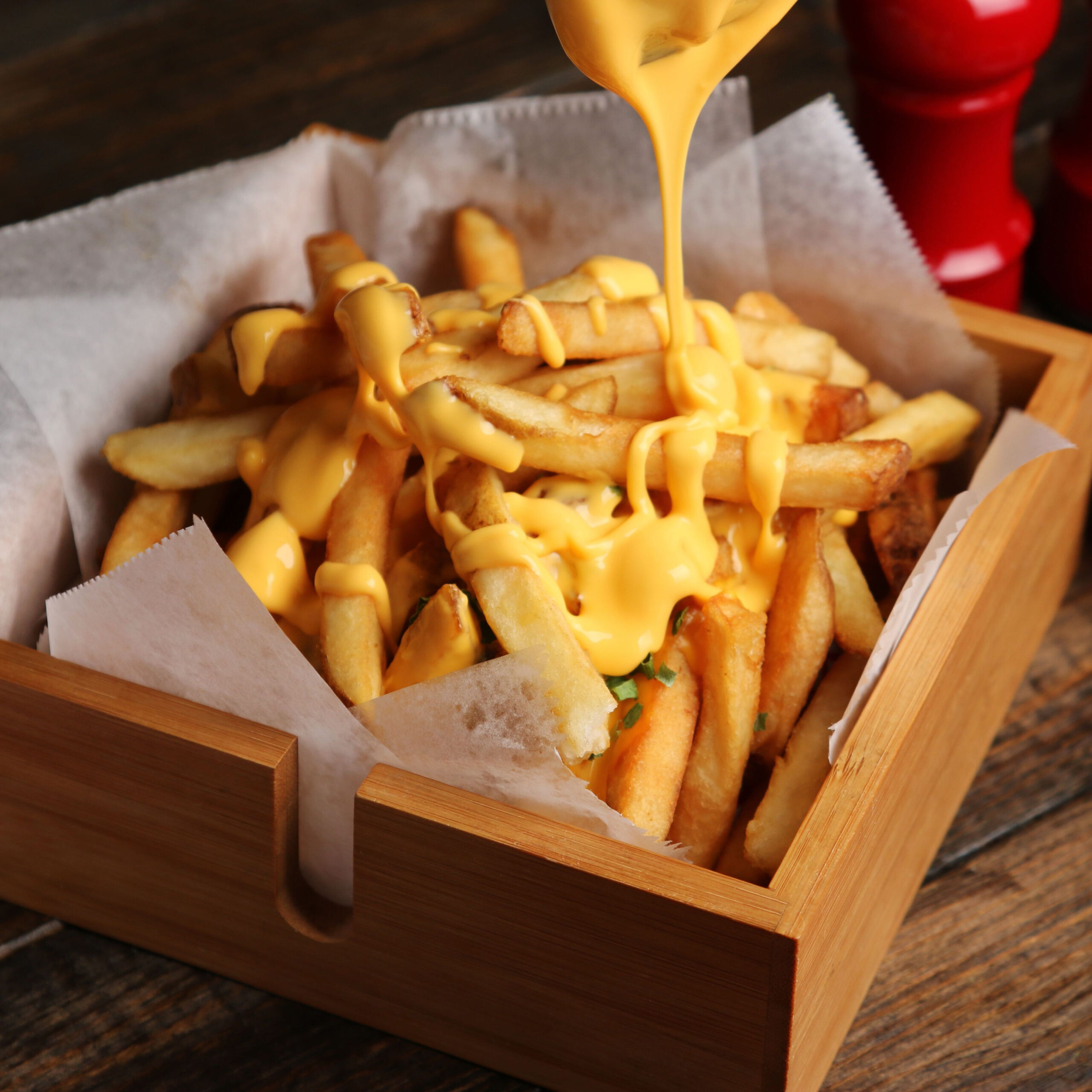 cheese sauce drizzled on french fries