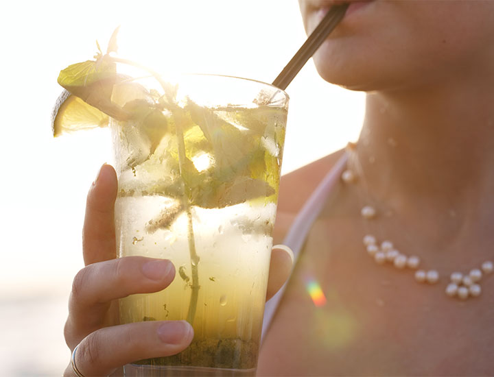 Close up of woman drinking margarita