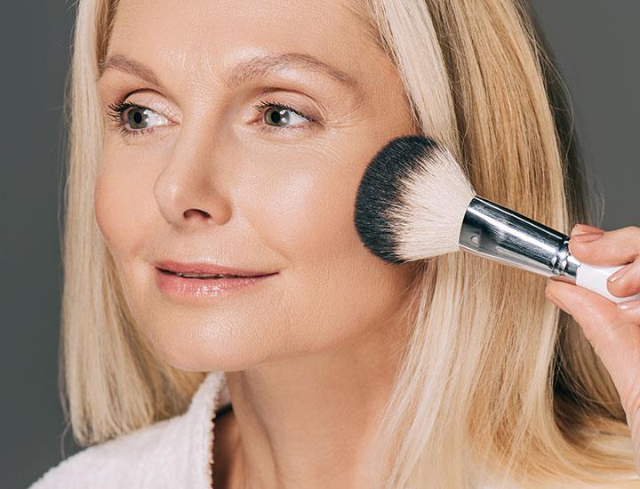 woman-using-makeup-brush