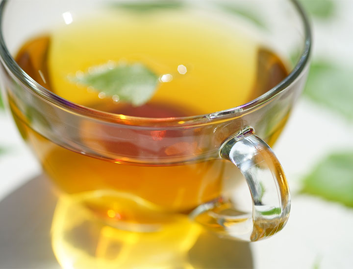 Closeup of teacup of green tea