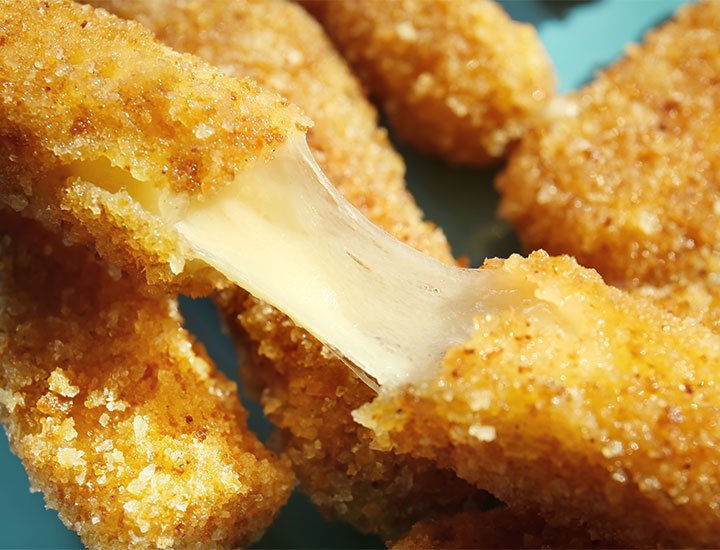 Closeup of mozzarella stick cheese pull