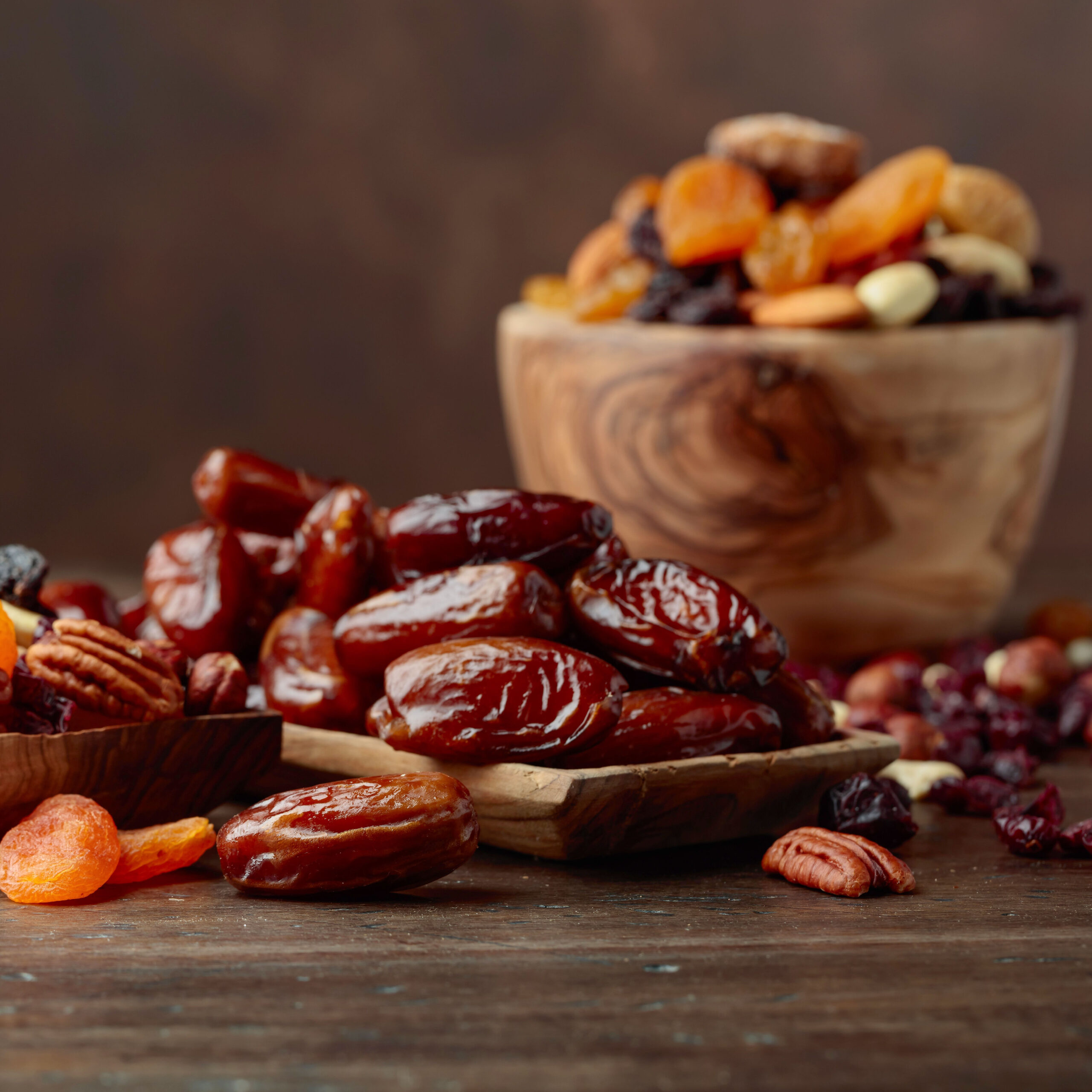 dates and nuts in bowl and on table