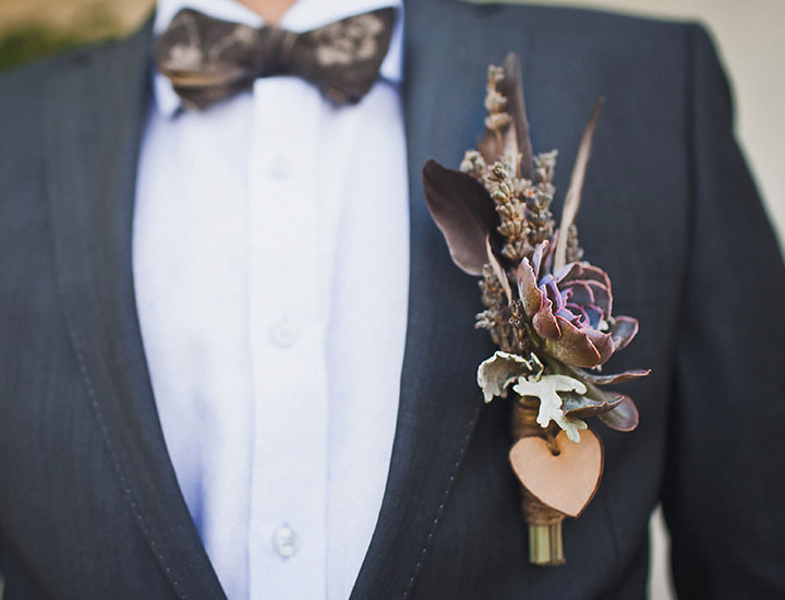 Man wearing oversized boutonnieres