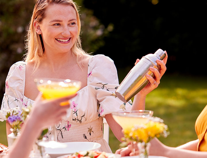 Woman making cocktails