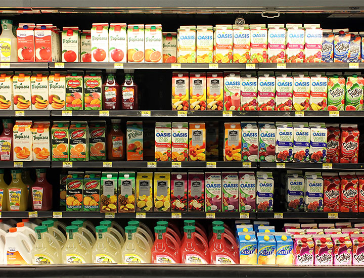 Fruit juice shelves at grocery store