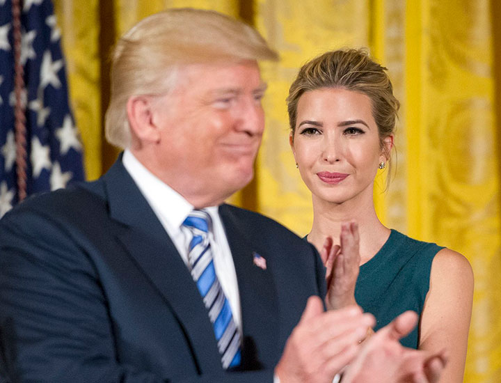 Ivanka and Donald Trump clapping at event