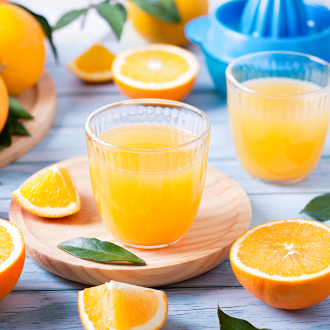 glass of orange juice on table