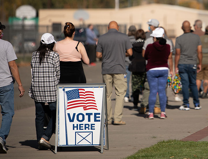 People standing in line to vote in election