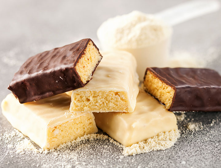 Protein bars stacked on a table