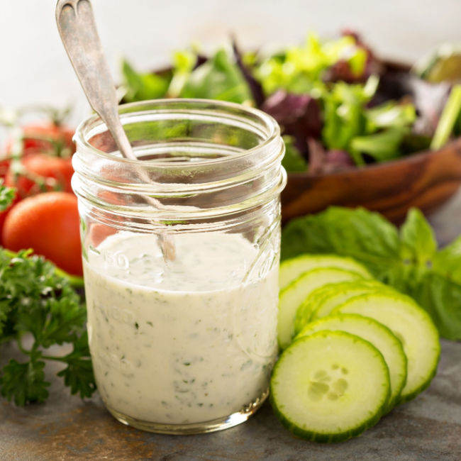 jar of ranch dressing beside veggies