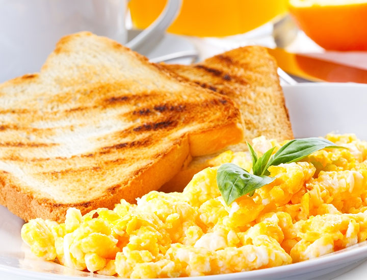 White toast with scrambled eggs