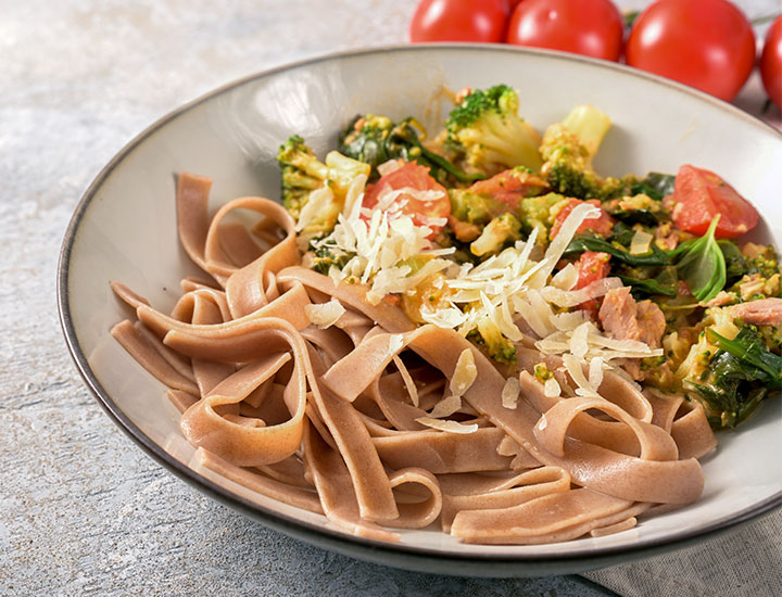 Whole grain pasta with a side of vegetables