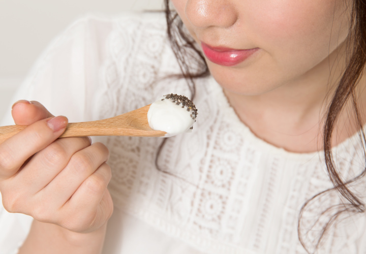 Woman eating yogurt