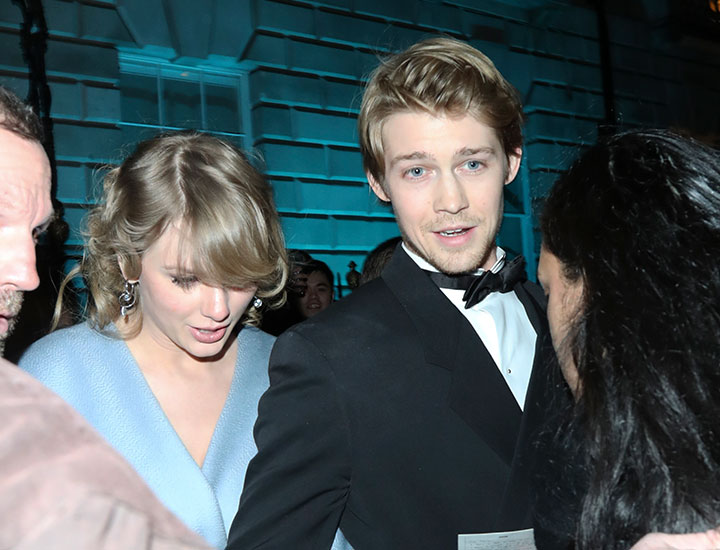 taylor swift joe alwyn london baftas suit and tie blue dress