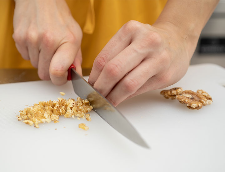 Chopping walnuts to cook with