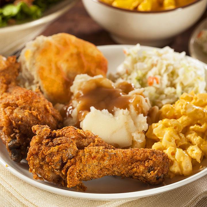 dinner plate with fried chicken, mashed potatoes, biscuit