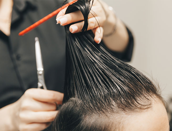 hair-dresser-trimming-hair