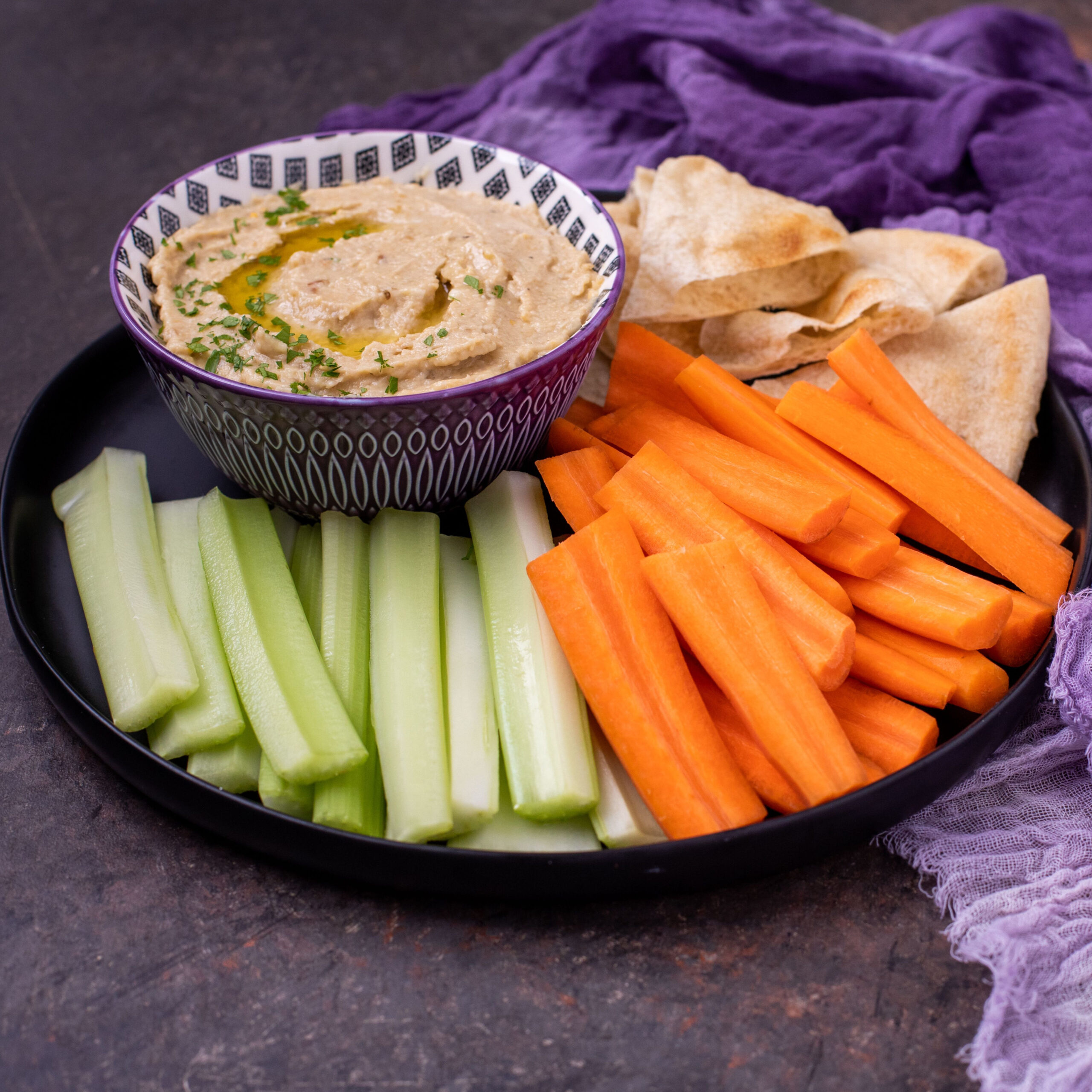 veggies and hummus on platter