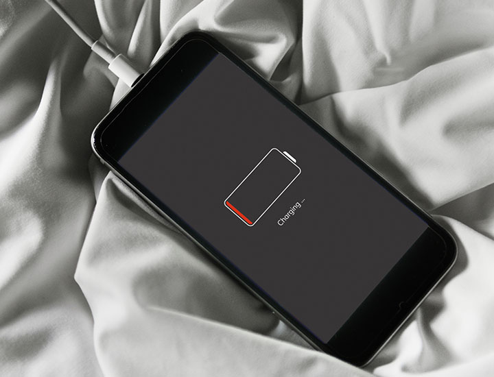 iphone-charging-on-bedsheets