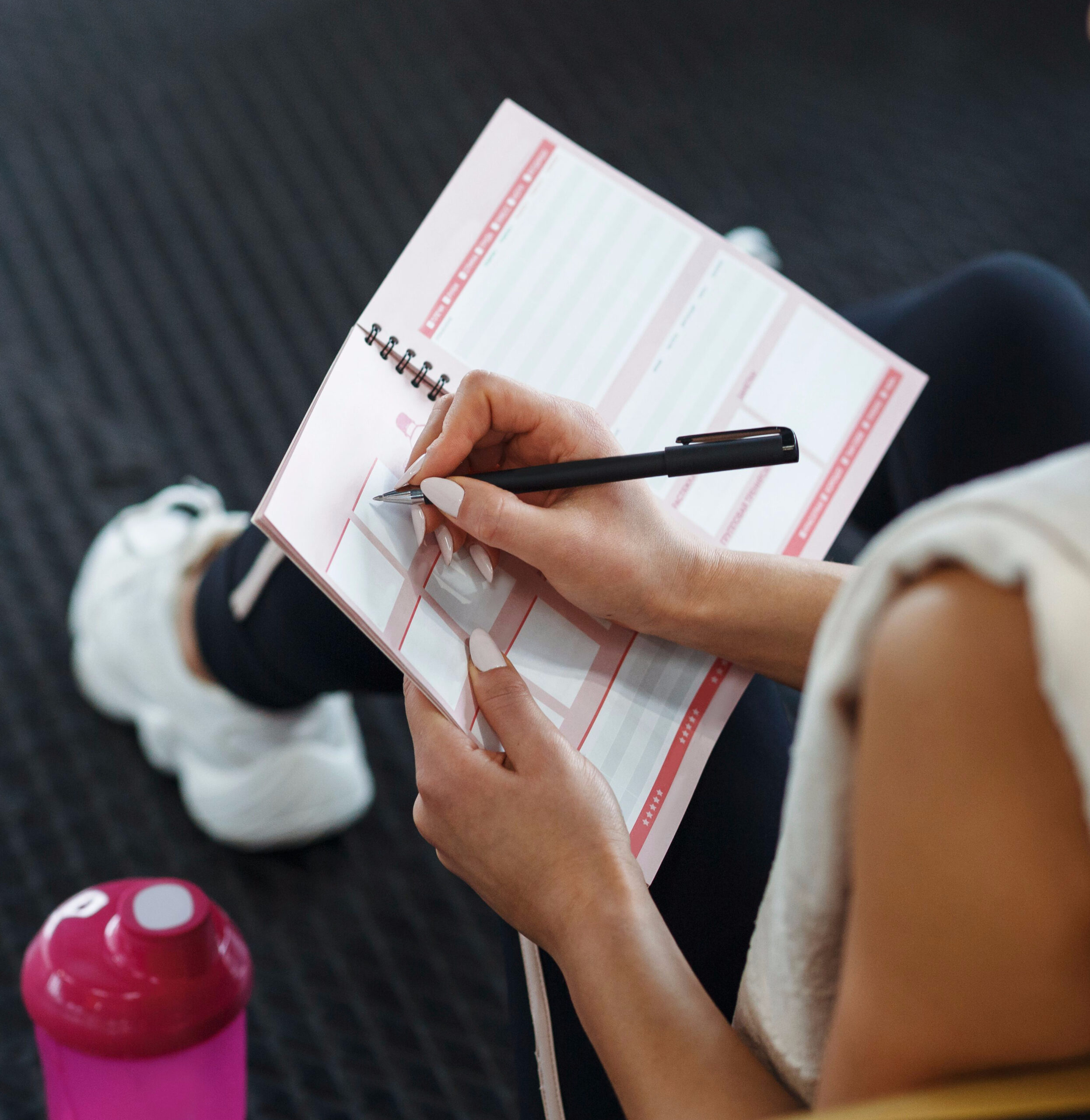 writing down gym food notes workout journal