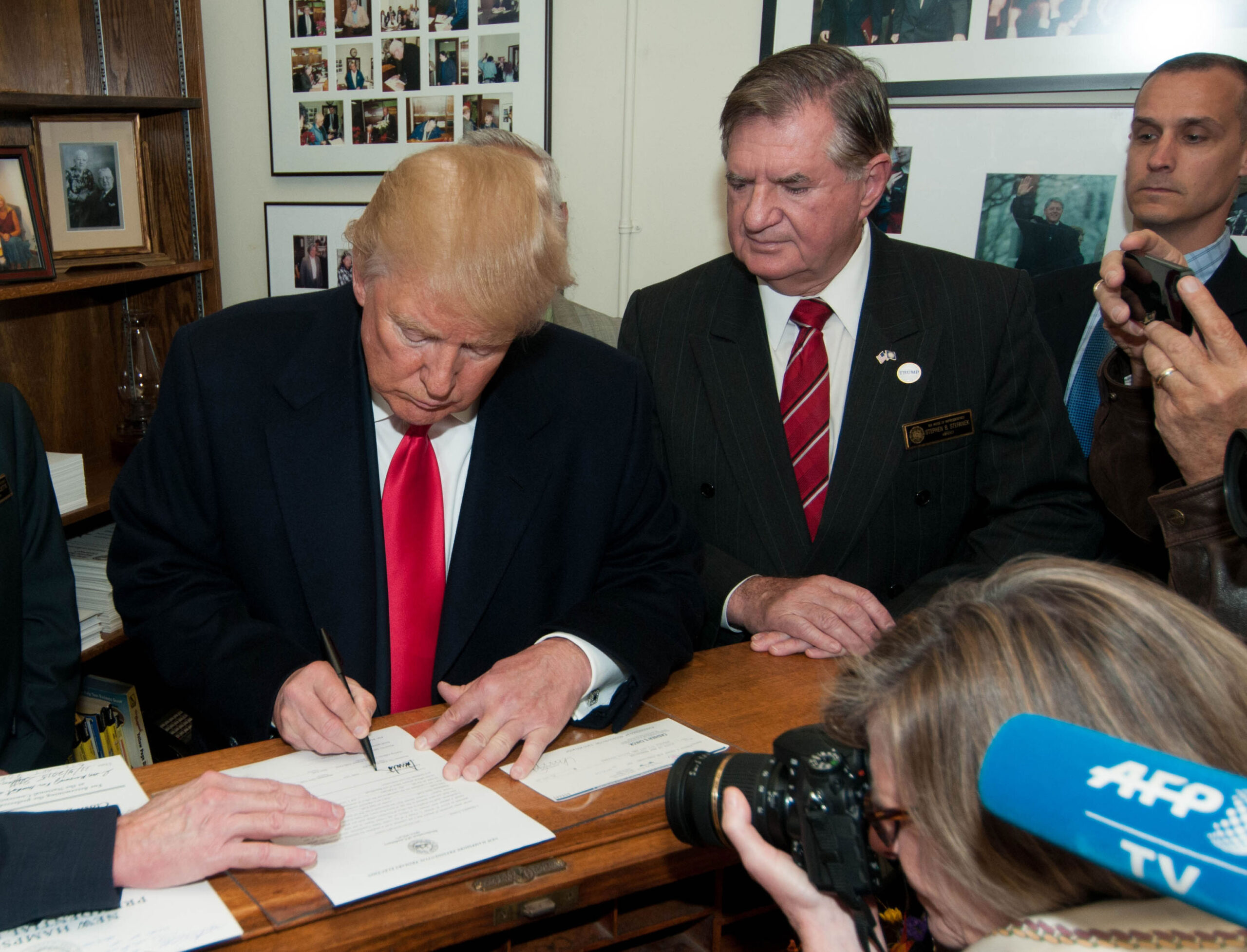 Donald Trump signing papers