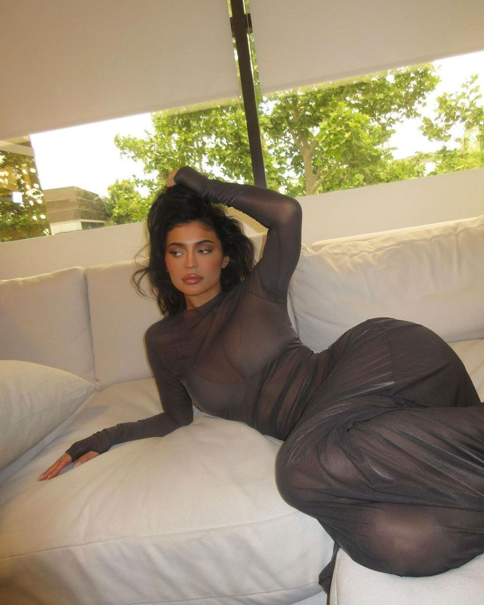 https://www.shefinds.com/files/2023/07/Kylie-Jenner-instagram-photos-on-couch-sheer-dress.jpg