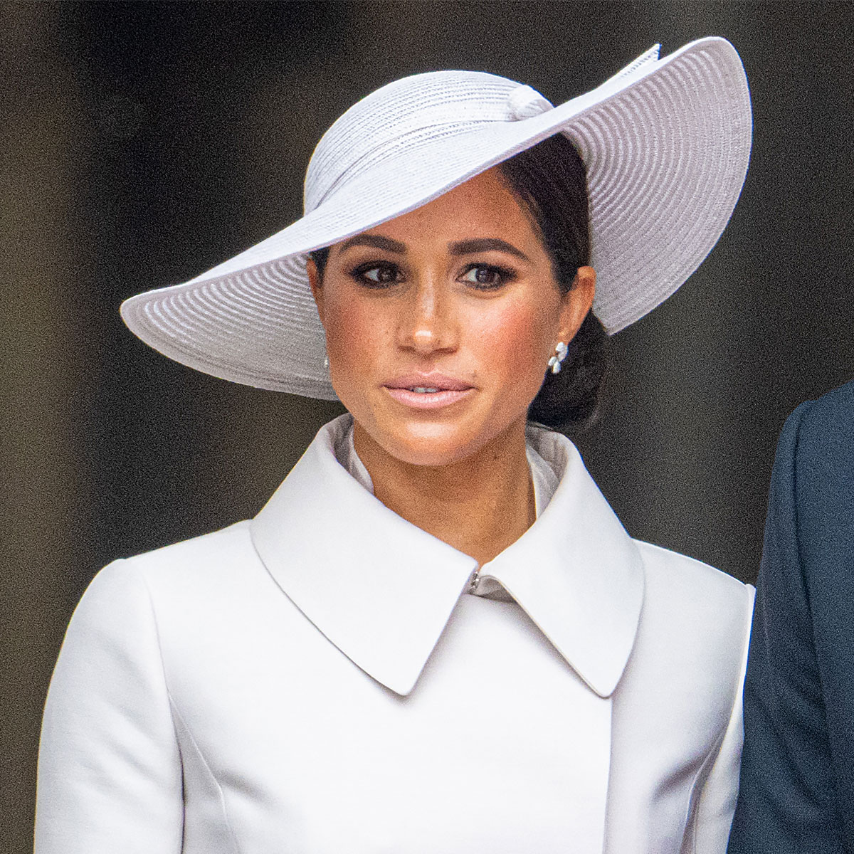 meghan markle white ensemble white hat collared coat hair up