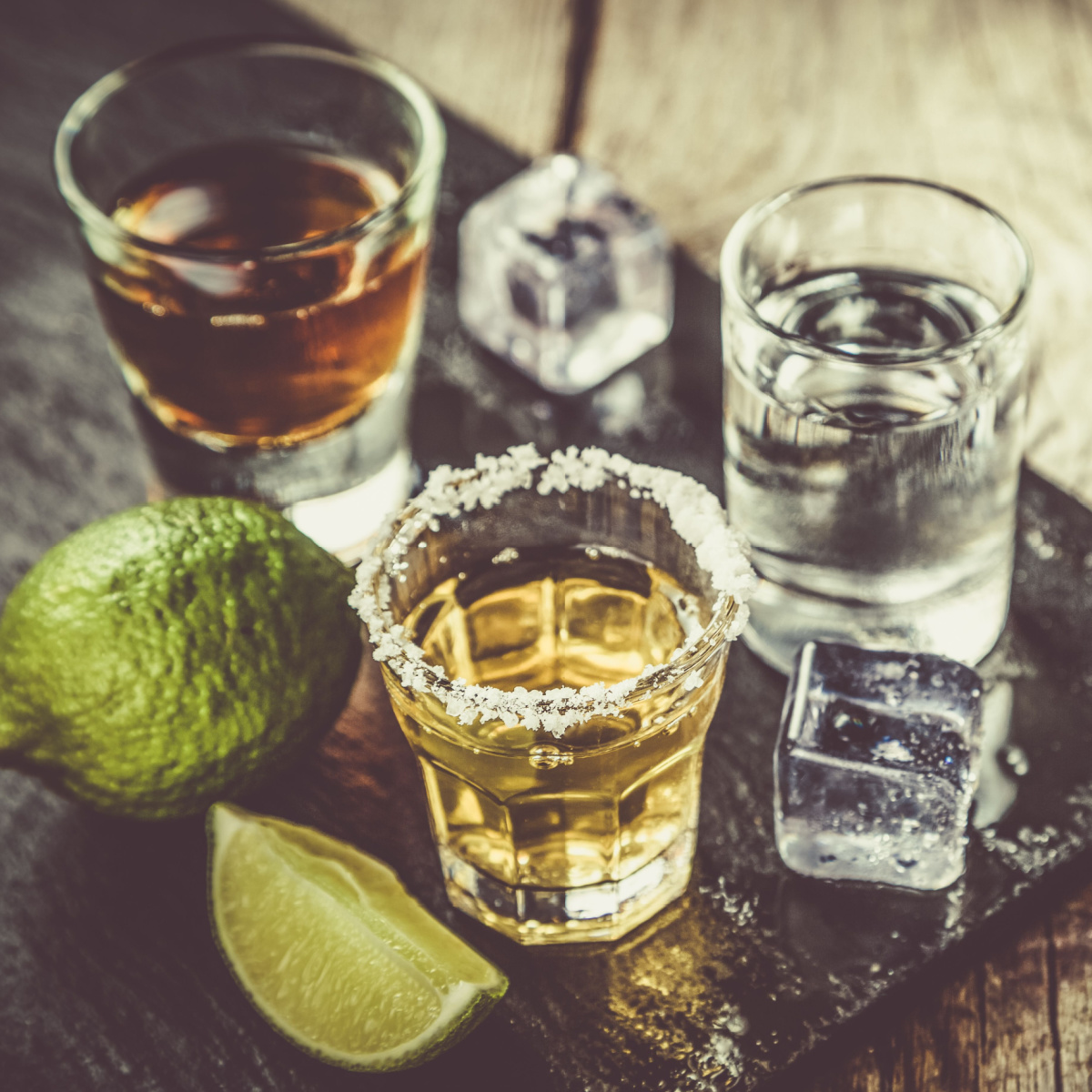 alcohol in shot glasses and lime