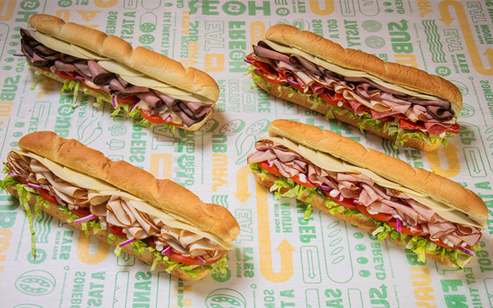 subway new deli heroes sandwiches lined up