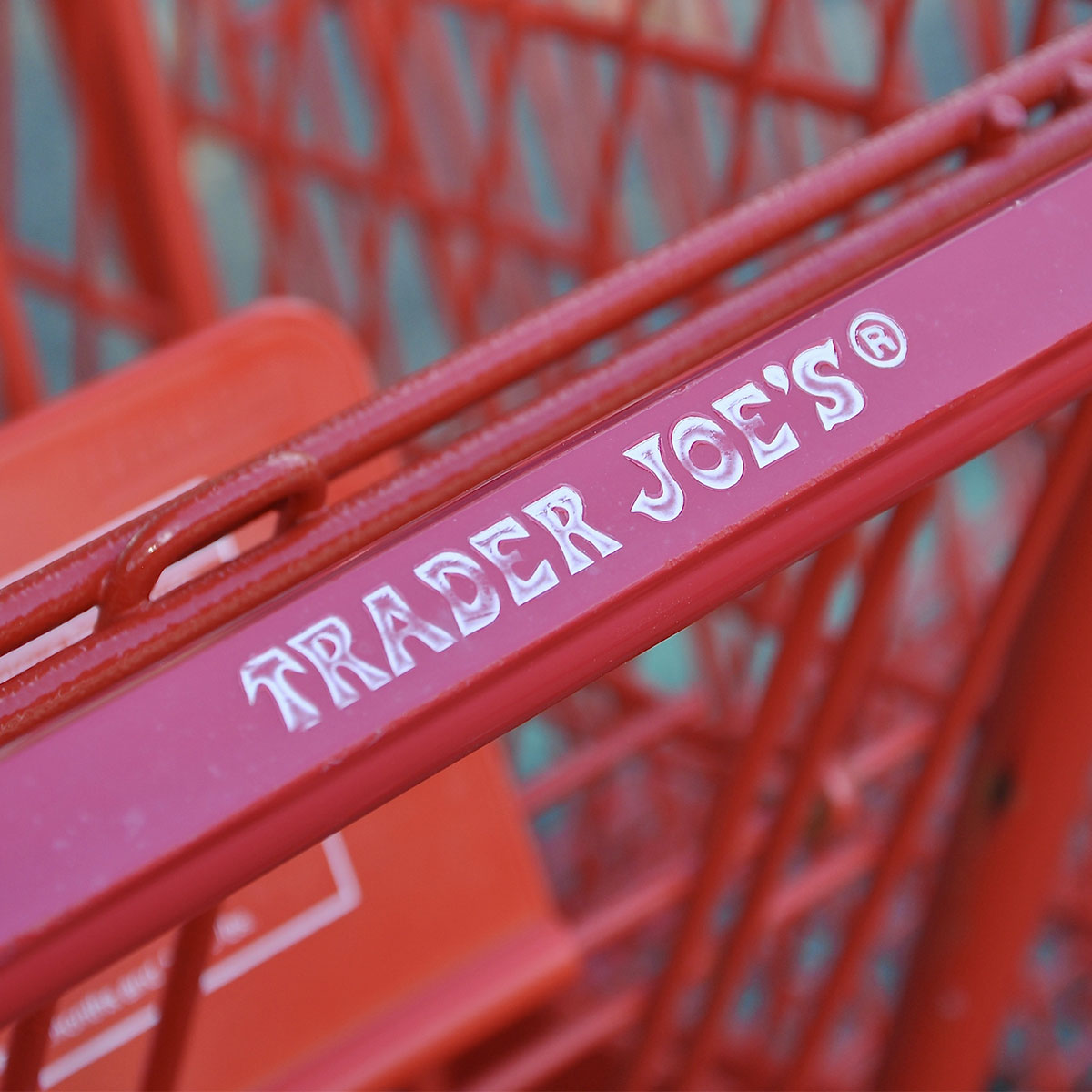 trader joe's shopping cart red handle up close