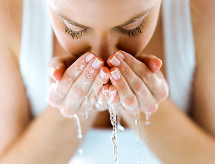 cleansing-face-over-sink