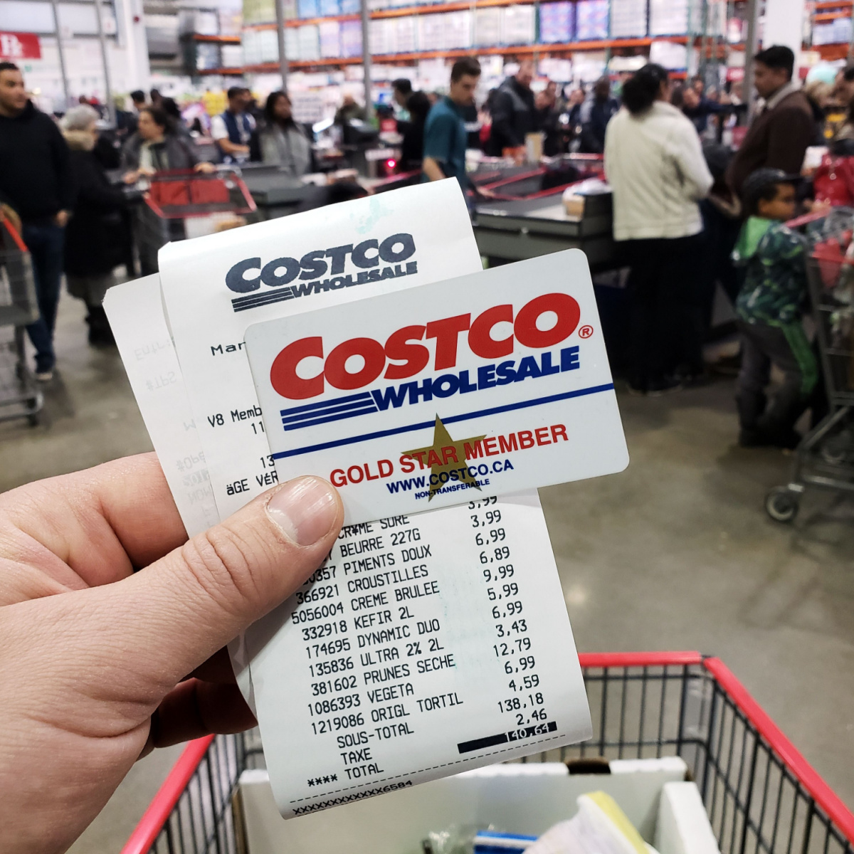 costco receipt store holding paper cart checkout