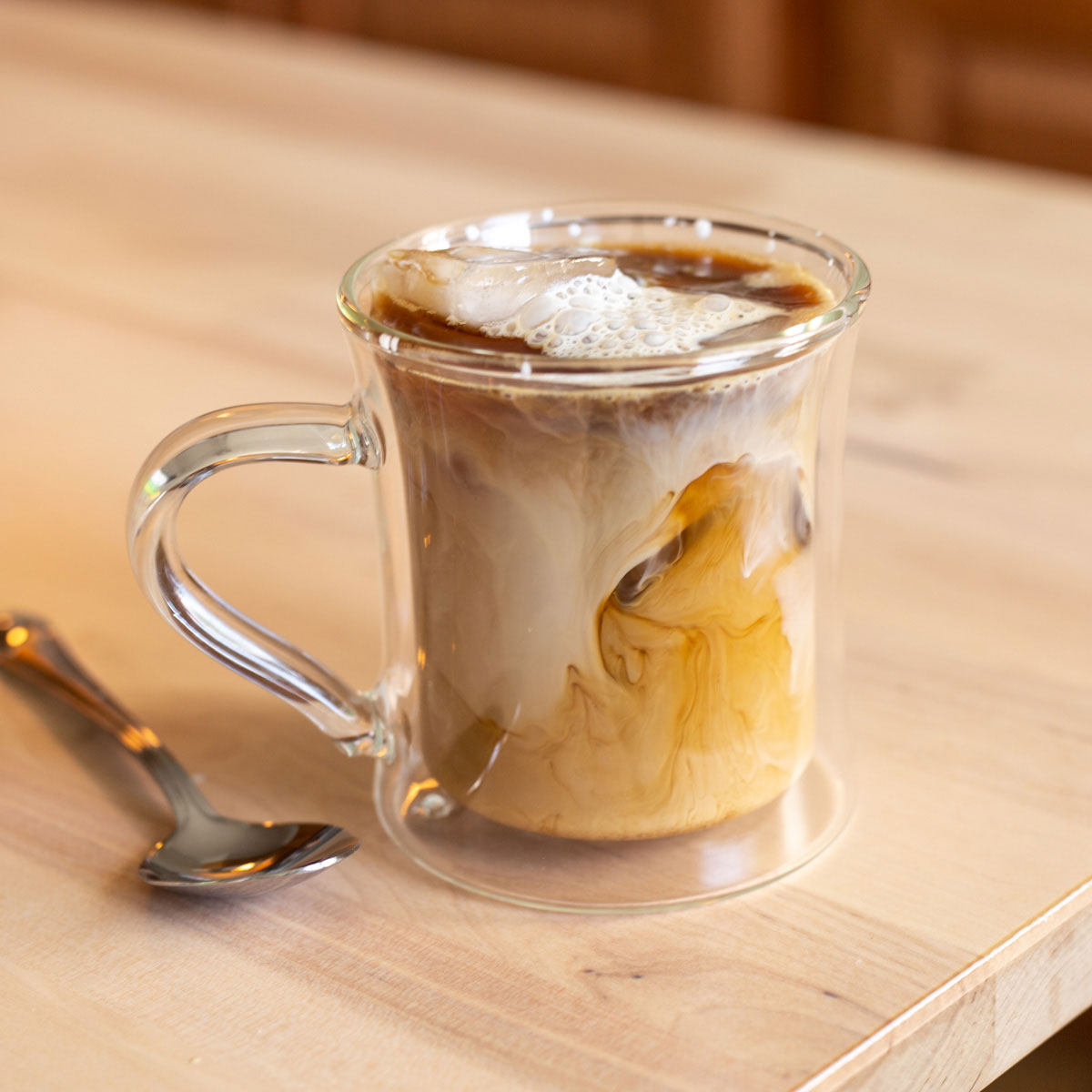 cup of coffee with milk clouds