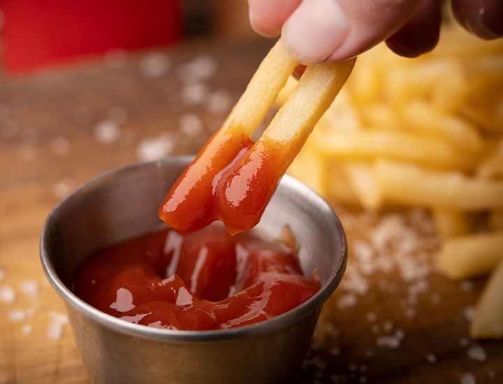 dipping fries in ketchup