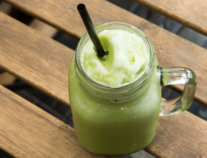 green tea smoothie in mason jar cup