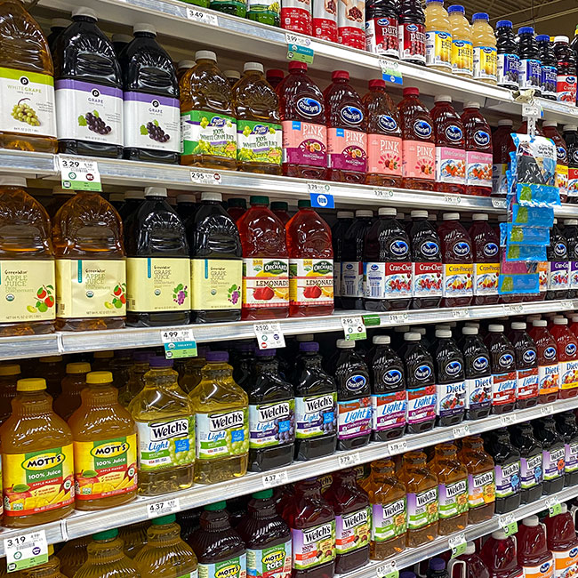 bottles of juice in grocery store