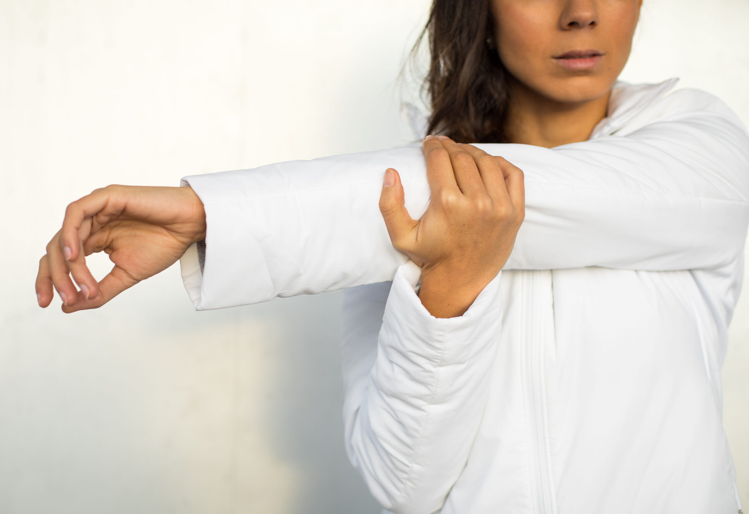 woman stretching shoulder