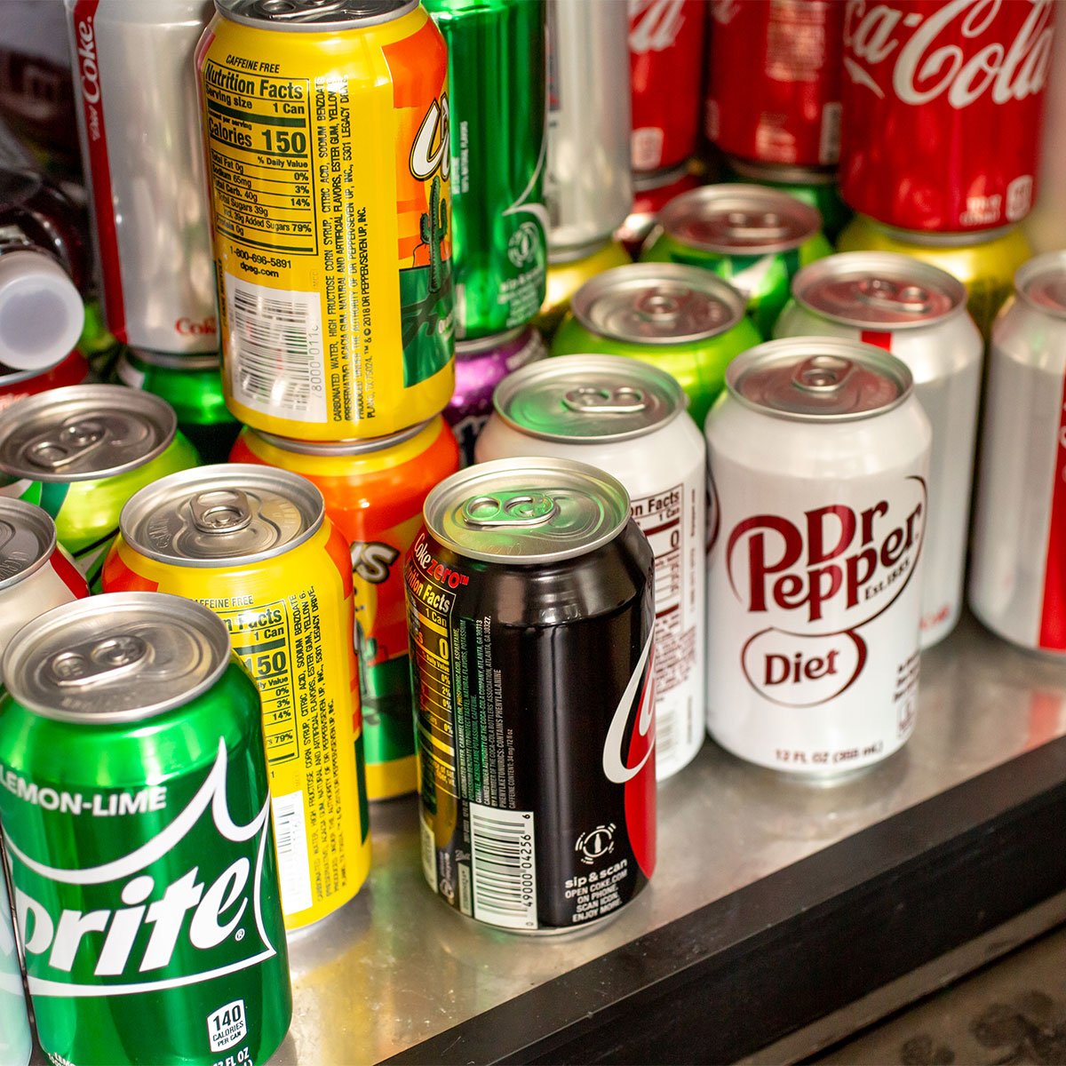 cans of soda in fridge