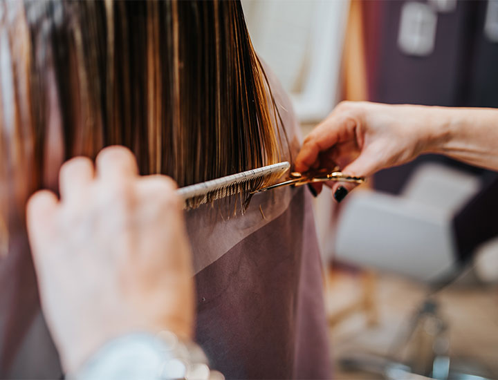 woman-getting-haircut-trim