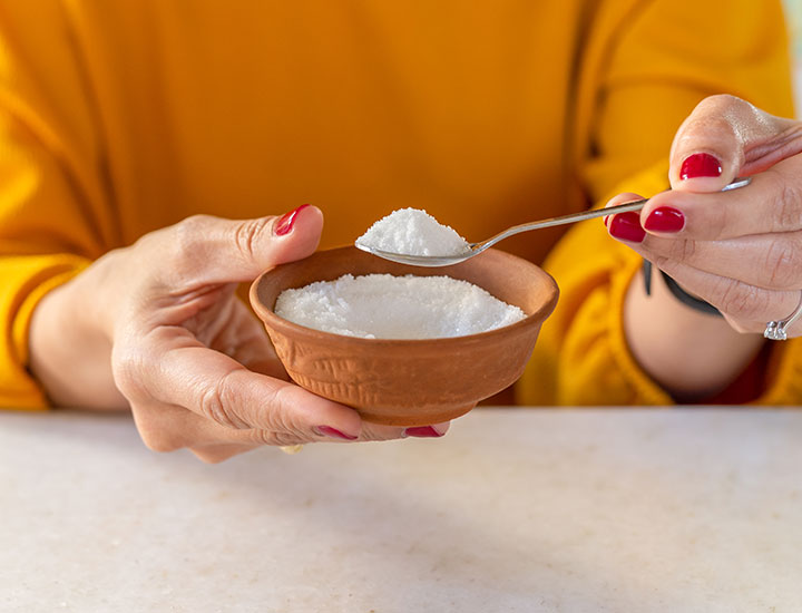 woman-holding-sugar-bowl-spoon