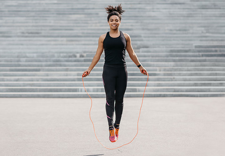 woman jump roping outside