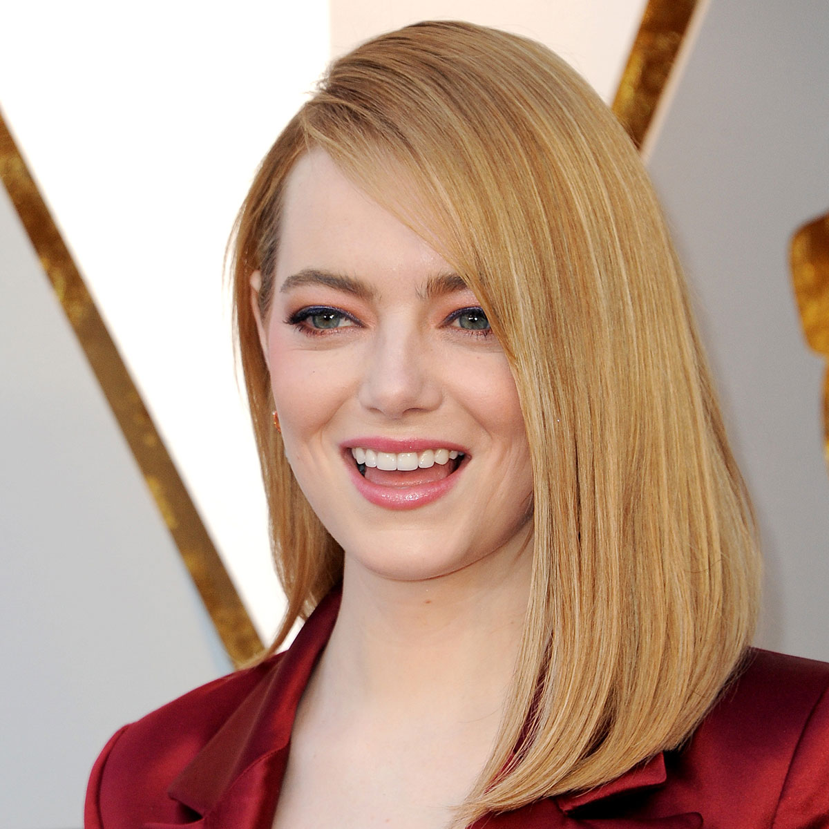Emma Stone Shows Off Her Tiny Waist In Cinched, Elegant White