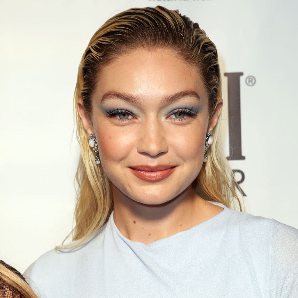 Gigi Hadid showcases her svelte abs in crop top as she pushes her daughter  Khai in her stroller