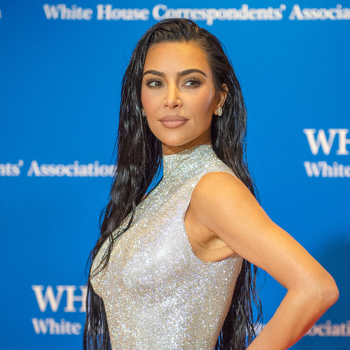 Kim Kardashian puts her chiseled abs on display in pink crop top